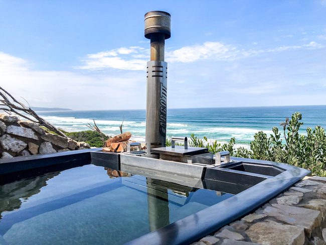 Carbo III Wood Fired Hot tub next to the sea.