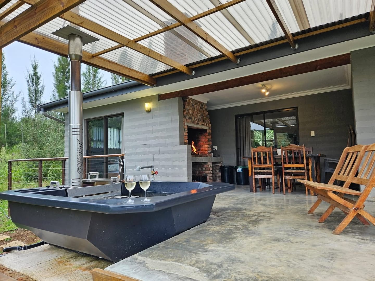 A Carbo III Hot Tub under roof on a patio